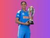 Harmanpreet Kaur holding the 2025 Women's Cricket World Cup trophy after leading India to its first title.